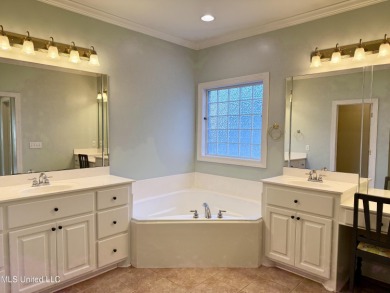 This inviting home sits on the Whisper Lake Golf Course in the on Annandale Golf Club in Mississippi - for sale on GolfHomes.com, golf home, golf lot