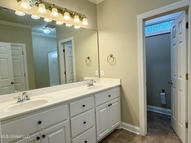 This inviting home sits on the Whisper Lake Golf Course in the on Annandale Golf Club in Mississippi - for sale on GolfHomes.com, golf home, golf lot