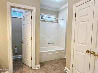 This inviting home sits on the Whisper Lake Golf Course in the on Annandale Golf Club in Mississippi - for sale on GolfHomes.com, golf home, golf lot
