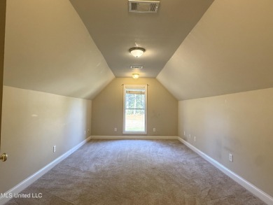 This inviting home sits on the Whisper Lake Golf Course in the on Annandale Golf Club in Mississippi - for sale on GolfHomes.com, golf home, golf lot