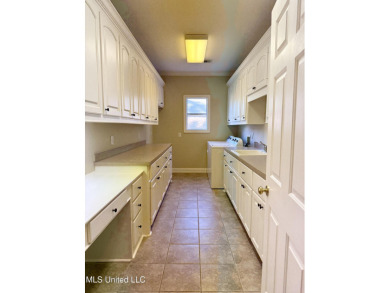 This inviting home sits on the Whisper Lake Golf Course in the on Annandale Golf Club in Mississippi - for sale on GolfHomes.com, golf home, golf lot