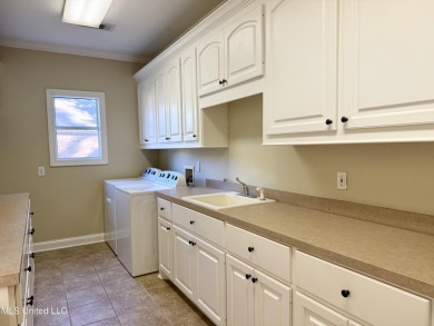 This inviting home sits on the Whisper Lake Golf Course in the on Annandale Golf Club in Mississippi - for sale on GolfHomes.com, golf home, golf lot
