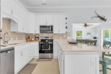 This Key Colony Beach coastal retreat blends modern elegance on Key Colony Beach Golf Course in Florida - for sale on GolfHomes.com, golf home, golf lot