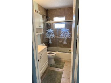 Charming and updated 2-bedroom, 1-bath, 1-car garage home on an on Duffys Golf Center in Florida - for sale on GolfHomes.com, golf home, golf lot