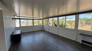 Charming and updated 2-bedroom, 1-bath, 1-car garage home on an on Duffys Golf Center in Florida - for sale on GolfHomes.com, golf home, golf lot