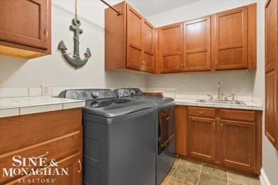 Nestled on a quiet cul-de-sac in the prestigious St. Clair Golf on St Clair River Country Club in Michigan - for sale on GolfHomes.com, golf home, golf lot