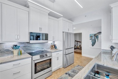 GORGEOUS fully renovated WATERFRONT corner residence in The Bay on Terra Ceia Golf and Country Club in Florida - for sale on GolfHomes.com, golf home, golf lot