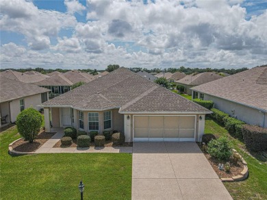 Welcome to this charming Challedon model home, nestled in the on Eagle Ridge At Spruce Creek Country Club in Florida - for sale on GolfHomes.com, golf home, golf lot