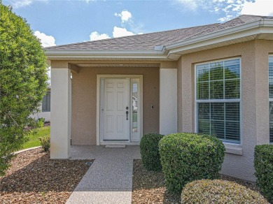 Welcome to this charming Challedon model home, nestled in the on Eagle Ridge At Spruce Creek Country Club in Florida - for sale on GolfHomes.com, golf home, golf lot