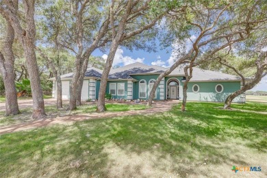 Welcome to 13th Fairway that hosts a beautifully appointed on Rockport Country Club in Texas - for sale on GolfHomes.com, golf home, golf lot