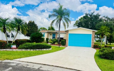 Experience the perfect coastal feel in this beautiful on Pine Lakes Country Club in Florida - for sale on GolfHomes.com, golf home, golf lot