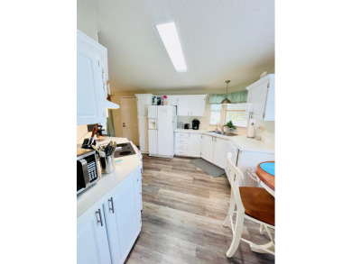 Experience the perfect coastal feel in this beautiful on Pine Lakes Country Club in Florida - for sale on GolfHomes.com, golf home, golf lot
