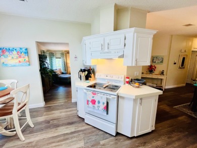 Experience the perfect coastal feel in this beautiful on Pine Lakes Country Club in Florida - for sale on GolfHomes.com, golf home, golf lot