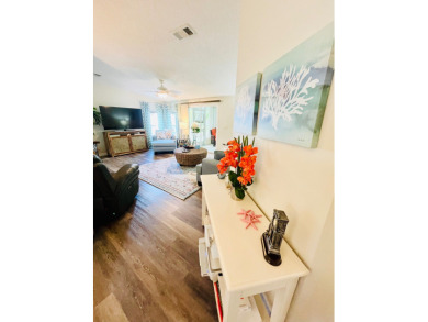 Experience the perfect coastal feel in this beautiful on Pine Lakes Country Club in Florida - for sale on GolfHomes.com, golf home, golf lot