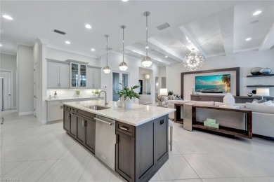 Step into unparalleled luxury in the prestigious Marsh Cove in on The Golf Club At Fiddlers Creek in Florida - for sale on GolfHomes.com, golf home, golf lot