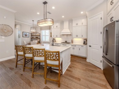 Come on into a beautiful, sophisticated coastal, Sea Star model on Boca Royale Golf and Country Club in Florida - for sale on GolfHomes.com, golf home, golf lot