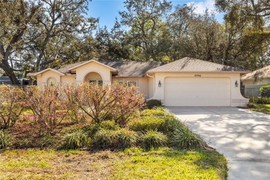 Welcome to this charming and well-maintained 2-bedroom, 2-bath on Oak Hills Country Club in Florida - for sale on GolfHomes.com, golf home, golf lot