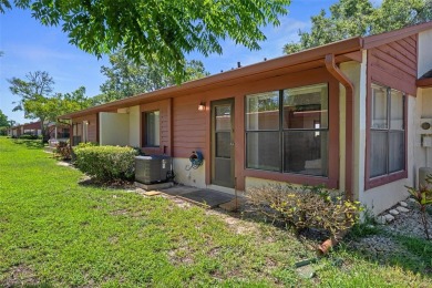 Come home to relaxed Florida living in a beautifully cared-for on Beacon Woods Golf Club in Florida - for sale on GolfHomes.com, golf home, golf lot