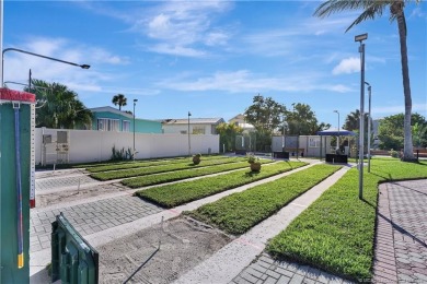 OFFERS WELCOME! This charming two-bedroom, one-bath home is on Island Dunes Country Club in Florida - for sale on GolfHomes.com, golf home, golf lot