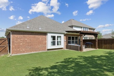 This beautiful single-story home in Hidden Cove is located just on Frisco Lakes Golf Course in Texas - for sale on GolfHomes.com, golf home, golf lot