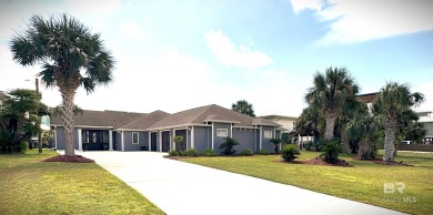 Ever dream of living on Marina Road? This single-story home on Orange Beach Golf Center in Alabama - for sale on GolfHomes.com, golf home, golf lot