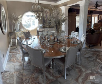 Ever dream of living on Marina Road? This single-story home on Orange Beach Golf Center in Alabama - for sale on GolfHomes.com, golf home, golf lot
