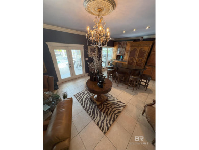 Ever dream of living on Marina Road? This single-story home on Orange Beach Golf Center in Alabama - for sale on GolfHomes.com, golf home, golf lot