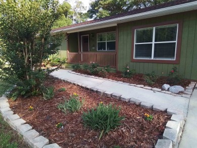 Don't miss this one! Beautifully shaded, freshly painted, well on Wildwood Country Club in Florida - for sale on GolfHomes.com, golf home, golf lot