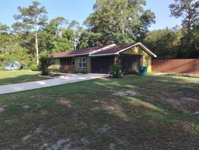 Don't miss this one! Beautifully shaded, freshly painted, well on Wildwood Country Club in Florida - for sale on GolfHomes.com, golf home, golf lot