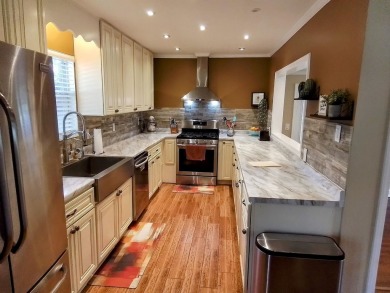 Don't miss this one! Beautifully shaded, freshly painted, well on Wildwood Country Club in Florida - for sale on GolfHomes.com, golf home, golf lot