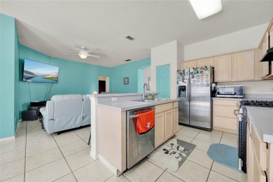 Welcome to this beautiful 4-bedroom, 2-bath, heated pool home on Polo Park East in Florida - for sale on GolfHomes.com, golf home, golf lot