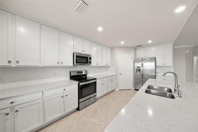 Please enjoy this beautifully upgraded first floor end unit on Sarasota National Golf Club in Florida - for sale on GolfHomes.com, golf home, golf lot