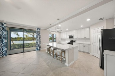 Please enjoy this beautifully upgraded first floor end unit on Sarasota National Golf Club in Florida - for sale on GolfHomes.com, golf home, golf lot