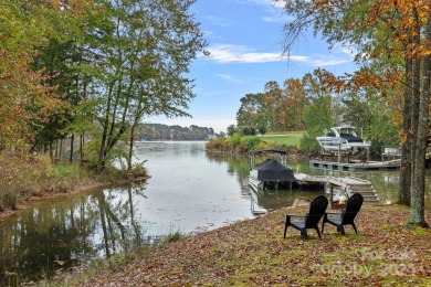 Experience waterfront luxury  long-range golf views from this on Trump National Golf Club Charlotte in North Carolina - for sale on GolfHomes.com, golf home, golf lot