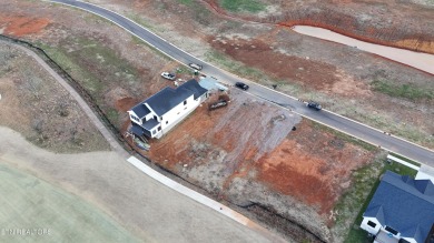 This charming lot is ideally located, backing up to a stunning on Tennessee National Golf Club in Tennessee - for sale on GolfHomes.com, golf home, golf lot