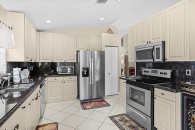 Welcome to this stunning home in a gated community and golfer's on Westchester Golf and Country Club in Florida - for sale on GolfHomes.com, golf home, golf lot