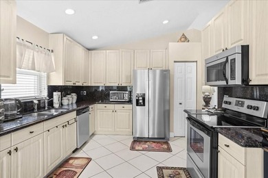 Welcome to this stunning home in a gated community and golfer's on Westchester Golf and Country Club in Florida - for sale on GolfHomes.com, golf home, golf lot