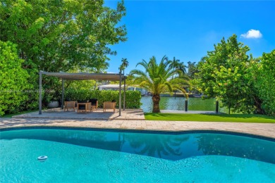 Exceptional fully renovated waterfront residence located on the on Normandy Shores Golf Course in Florida - for sale on GolfHomes.com, golf home, golf lot
