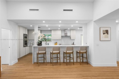 Exceptional fully renovated waterfront residence located on the on Normandy Shores Golf Course in Florida - for sale on GolfHomes.com, golf home, golf lot