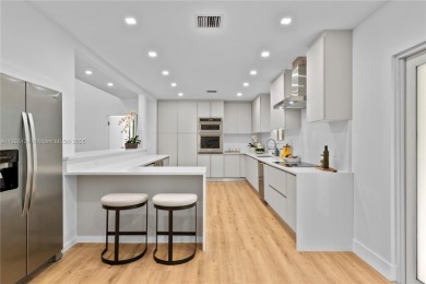 Exceptional fully renovated waterfront residence located on the on Normandy Shores Golf Course in Florida - for sale on GolfHomes.com, golf home, golf lot