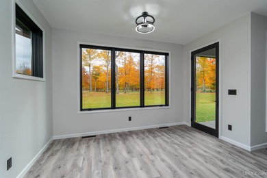 Experience refined modern living in this stunning 2025 on Indian Lake Golf and Country Club in Michigan - for sale on GolfHomes.com, golf home, golf lot
