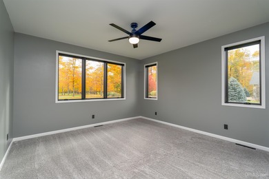 Experience refined modern living in this stunning 2025 on Indian Lake Golf and Country Club in Michigan - for sale on GolfHomes.com, golf home, golf lot