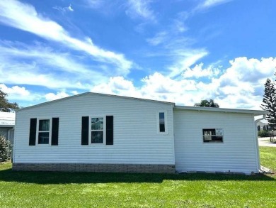 This charming 2-bedroom, 2-bathroom home is move-in ready and on Crystal Lake Club in Florida - for sale on GolfHomes.com, golf home, golf lot