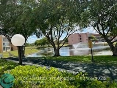 WELCOME TO THIIS CHARMING FIRST FLOOR CONDO, PERFECTLY SITUATED on Sunrise Lakes Phase III in Florida - for sale on GolfHomes.com, golf home, golf lot