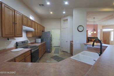 Popular Portland model home on the Fourth Hole of the Highlands on Heritage Highlands At Dove Mountain in Arizona - for sale on GolfHomes.com, golf home, golf lot