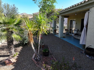 Popular Portland model home on the Fourth Hole of the Highlands on Heritage Highlands At Dove Mountain in Arizona - for sale on GolfHomes.com, golf home, golf lot