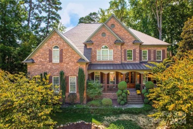 Welcome to this stunning home nestled in the prestigious Cowan on Cowans Ford Country Club in North Carolina - for sale on GolfHomes.com, golf home, golf lot