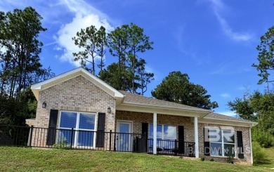 Super cute home perched at the end of a quiet and lovely cu de on Lake Forest Yacht and Country Club in Alabama - for sale on GolfHomes.com, golf home, golf lot