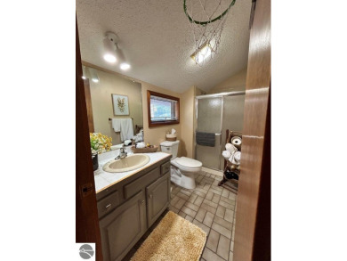 This exceptional three-bedroom, three-and-a-half bathroom condo on Shanty Creek Golf Course in Michigan - for sale on GolfHomes.com, golf home, golf lot
