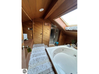This exceptional three-bedroom, three-and-a-half bathroom condo on Shanty Creek Golf Course in Michigan - for sale on GolfHomes.com, golf home, golf lot
